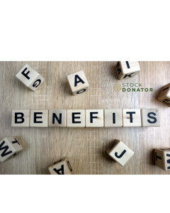 Benefits spelled out with wooden blocks, emphasizing the advantages of stock donations for nonprofits, with Stock Donator logo in the background.